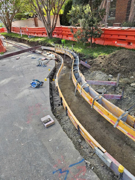 channel 9 - drainage system and kerb next to footpath